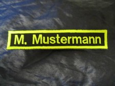 Namensschild schwarz neongelb